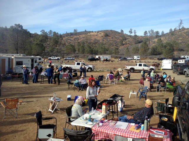 Field of people cooking and eating