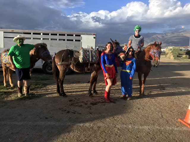 Mule riders dressed as Super Heroes