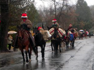 Horsemen in a parade in the rain