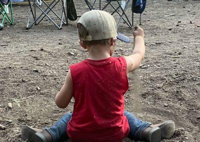 A young boy plays in the dirt at Kennedy Meadows campground